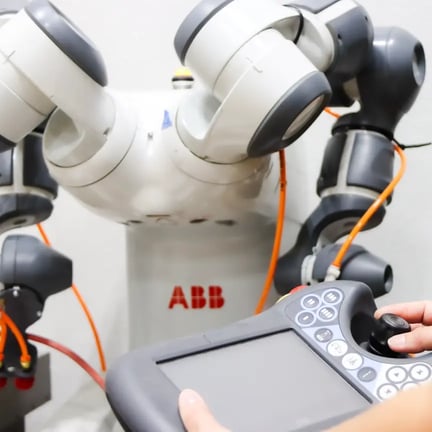 Hands controlling robot in R&D lab