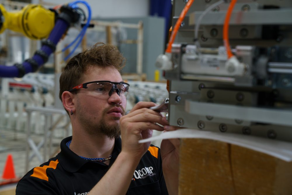 QComp Engineer Working on Robot